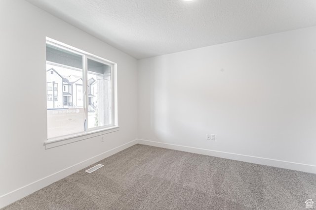 13719 S Devers Dr Unit 2106, Riverton, UT 84096 - unfurnished room featuring carpet floors, baseboards, and a textured ceiling