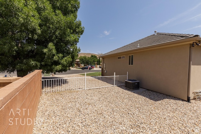 267 N 250 W, La Verkin, UT 84745 - view of home's exterior with central AC unit, stucco siding, and fence