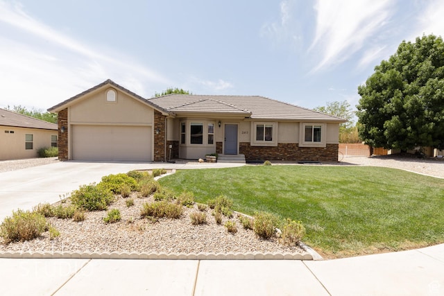 267 N 250 W, La Verkin, UT 84745 - single story home featuring concrete driveway, a front yard, stucco siding, a garage, and stone siding