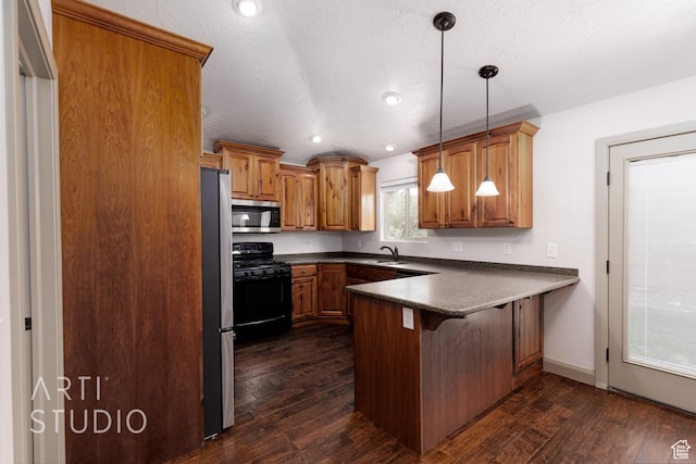 267 N 250 W, La Verkin, UT 84745 - kitchen featuring brown cabinets, a peninsula, stainless steel appliances, and dark wood-style flooring