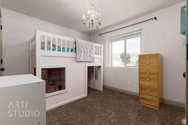 267 N 250 W, La Verkin, UT 84745 - unfurnished bedroom featuring a notable chandelier, carpet flooring, and baseboards