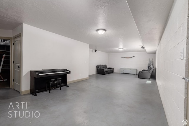 267 N 250 W, La Verkin, UT 84745 - interior space with concrete block wall, baseboards, and a textured ceiling