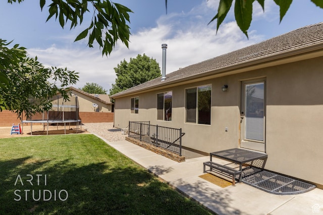 267 N 250 W, La Verkin, UT 84745 - view of yard with a patio, a trampoline, and fence