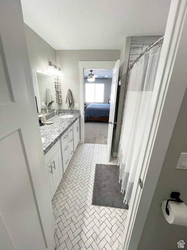 1999 E Abbey Way, Eagle Mountain, UT 84005 - ensuite bathroom with double vanity, a shower with curtain, ensuite bath, ceiling fan, and a sink