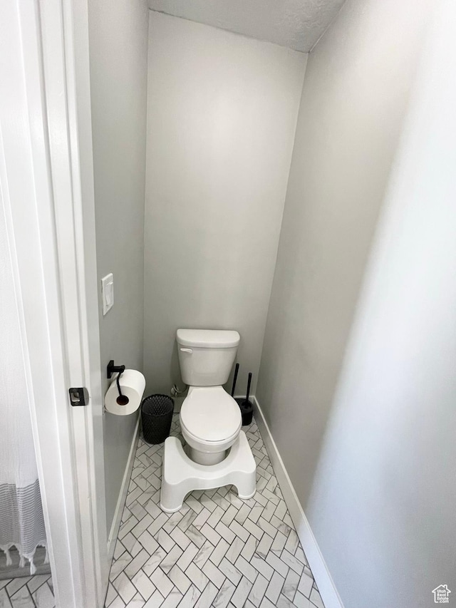 1999 E Abbey Way, Eagle Mountain, UT 84005 - bathroom with tile patterned floors, toilet, and baseboards