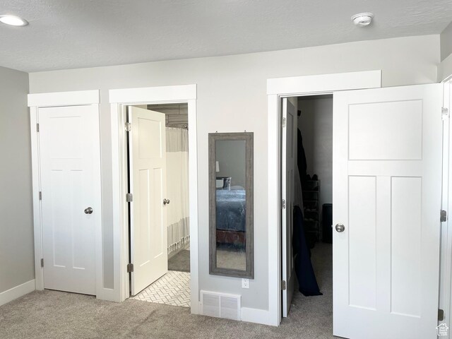 1999 E Abbey Way, Eagle Mountain, UT 84005 - unfurnished bedroom featuring baseboards, a textured ceiling, visible vents, and carpet flooring