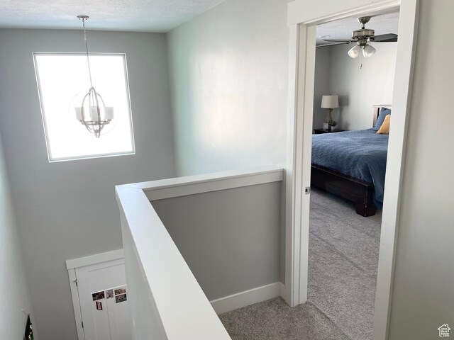 1999 E Abbey Way, Eagle Mountain, UT 84005 - hallway with carpet, a notable chandelier, and an upstairs landing
