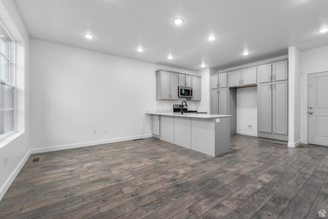 1791 N 180 E, Heber City, UT 84032 - kitchen featuring stainless steel microwave, a peninsula, dark wood-style flooring, and recessed lighting