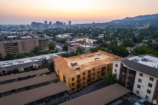 aerial view at dusk featuring a mountain view