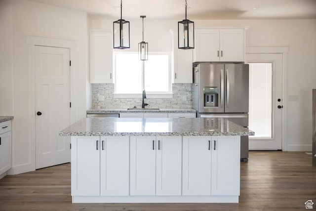 2159 W 520 S, Roosevelt, UT 84066 - kitchen featuring stainless steel fridge with ice dispenser, white cabinets, backsplash, and dark wood-style flooring