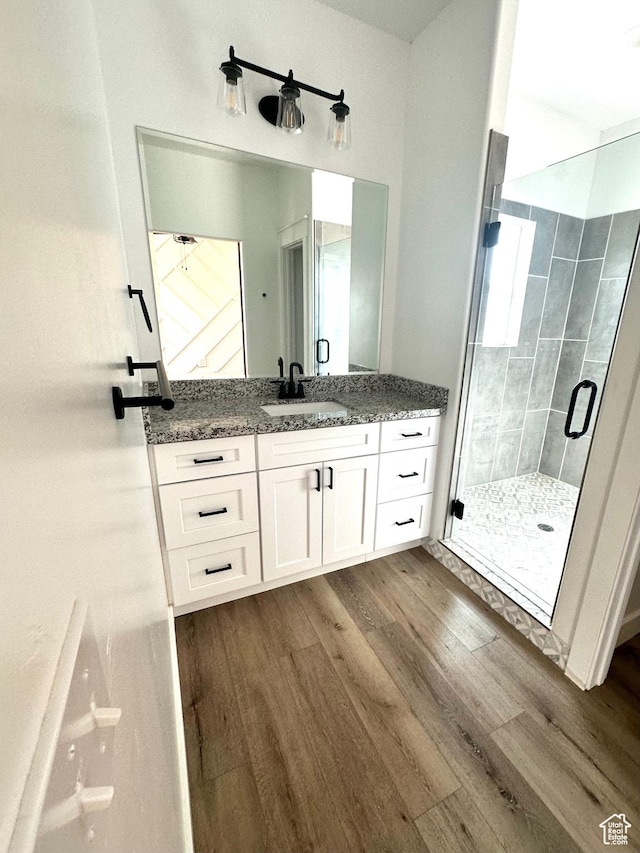 2159 W 520 S, Roosevelt, UT 84066 - bathroom with wood finished floors, vanity, and a stall shower