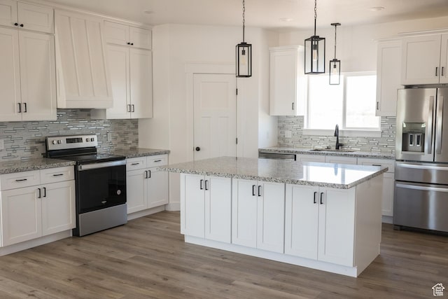2159 W 520 S, Roosevelt, UT 84066 - kitchen with stainless steel appliances, tasteful backsplash, a center island, and white cabinetry