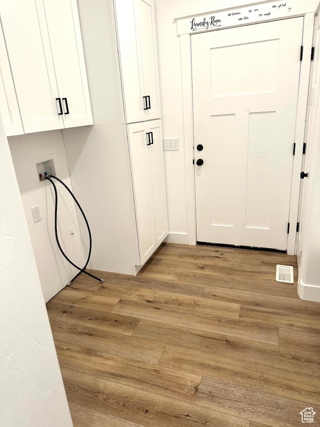 2159 W 520 S, Roosevelt, UT 84066 - washroom with cabinet space, light wood finished floors, and hookup for a washing machine