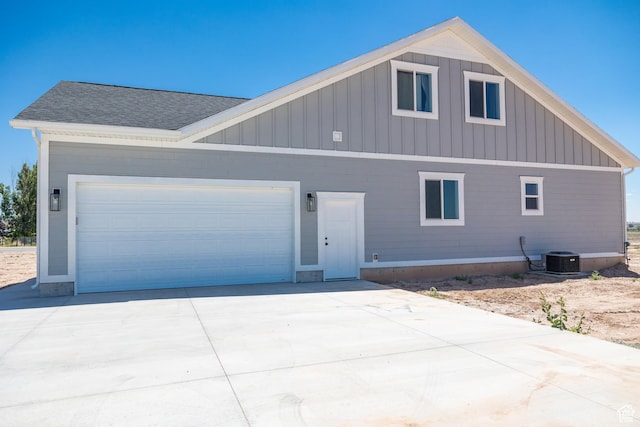 2159 W 520 S, Roosevelt, UT 84066 - view of front of house featuring board and batten siding, an attached garage, concrete driveway, and roof with shingles