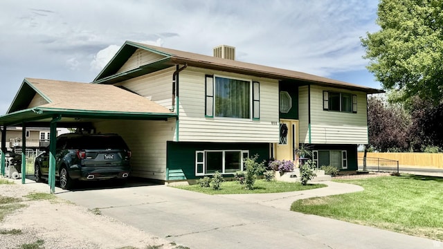 805 E 2910 S, Vernal, UT 84078 - split foyer home with a carport, fence, concrete driveway, and a front yard