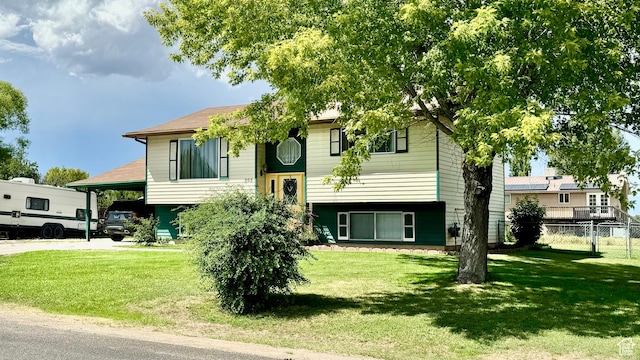805 E 2910 S, Vernal, UT 84078 - bi-level home with a carport, fence, driveway, and a front lawn