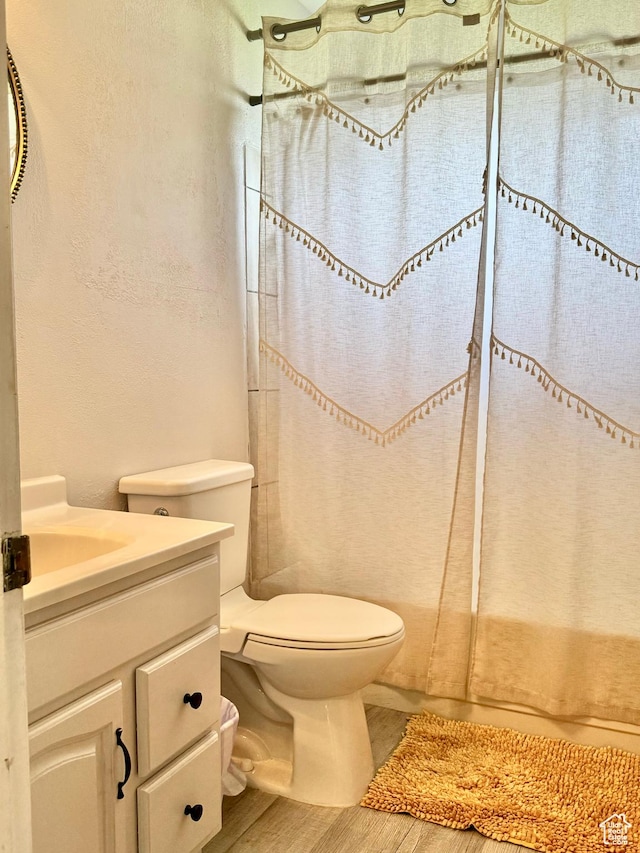 805 E 2910 S, Vernal, UT 84078 - full bath featuring wood finished floors, vanity, and toilet