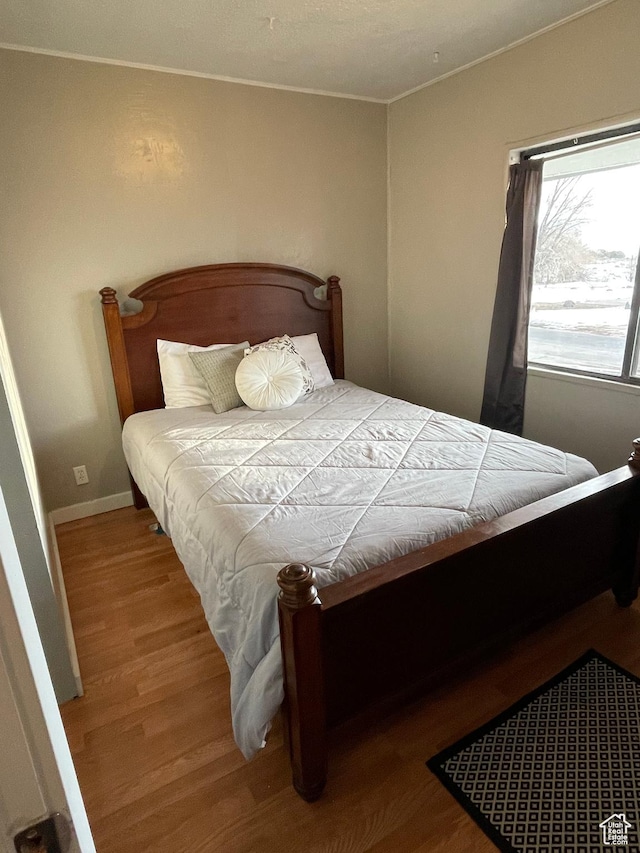 431 Circle Way, Sunnyside, UT 84539 - bedroom with hardwood / wood-style flooring and ornamental molding