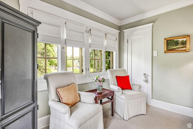 living area with a wealth of natural light, ornamental molding, and carpet