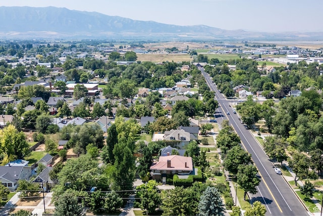 birds eye view of property featuring a mountain view