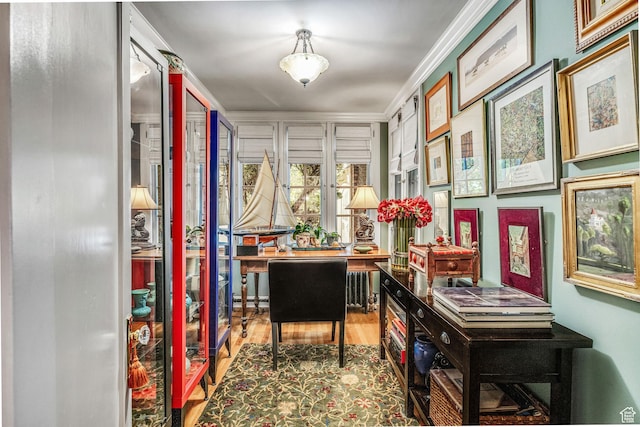 office featuring hardwood / wood-style flooring and ornamental molding