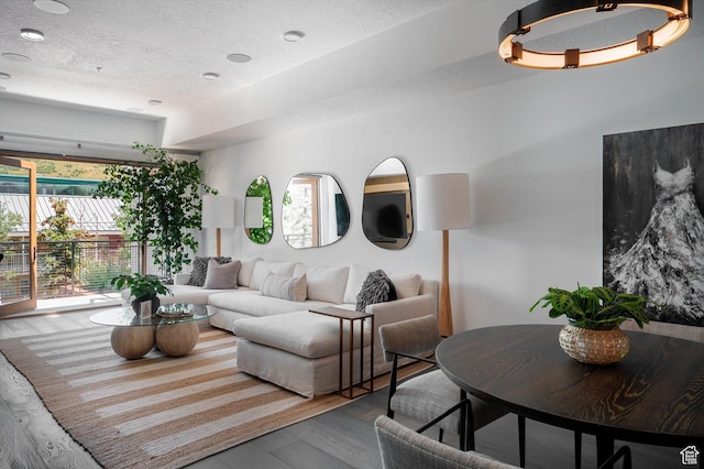 1271 Lowell Ave Unit B-103, Park City, UT 84060 - living area featuring a textured ceiling and wood finished floors