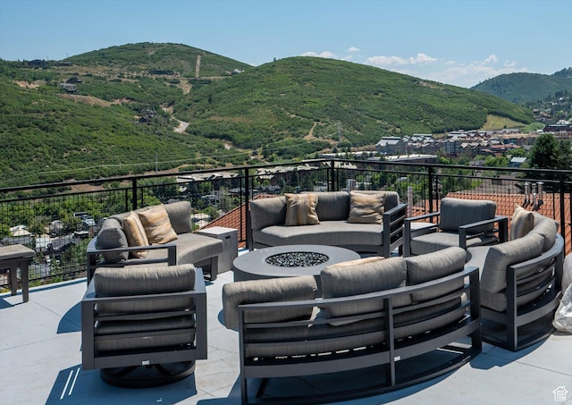 1271 Lowell Ave Unit B-103, Park City, UT 84060 - view of patio / terrace with an outdoor living space with a fire pit and a mountain view