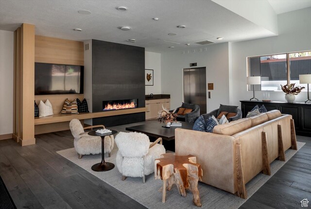 1271 Lowell Ave Unit B-103, Park City, UT 84060 - living room with elevator, a large fireplace, and wood finished floors