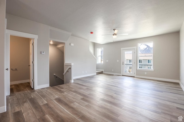 1072 S 2760 E, Spanish Fork, UT 84660 - spare room with a textured ceiling, ceiling fan, and hardwood / wood-style floors