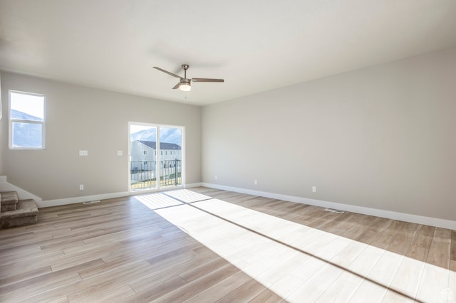 1068 S 2760 E, Spanish Fork, UT 84660 - spare room featuring light hardwood / wood-style flooring, a wealth of natural light, and ceiling fan