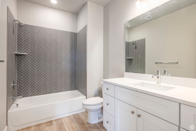 1068 S 2760 E, Spanish Fork, UT 84660 - full bathroom with vanity, toilet, tiled shower / bath, and hardwood / wood-style flooring