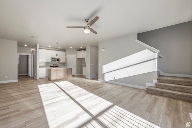 1068 S 2760 E, Spanish Fork, UT 84660 - unfurnished living room featuring light wood-type flooring and ceiling fan