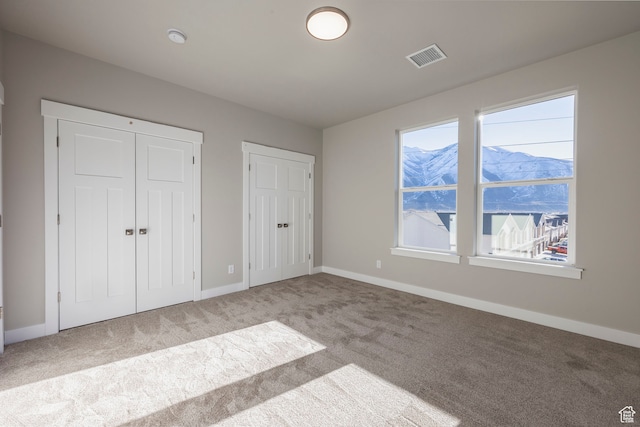 1068 S 2760 E, Spanish Fork, UT 84660 - unfurnished bedroom featuring two closets and light carpet