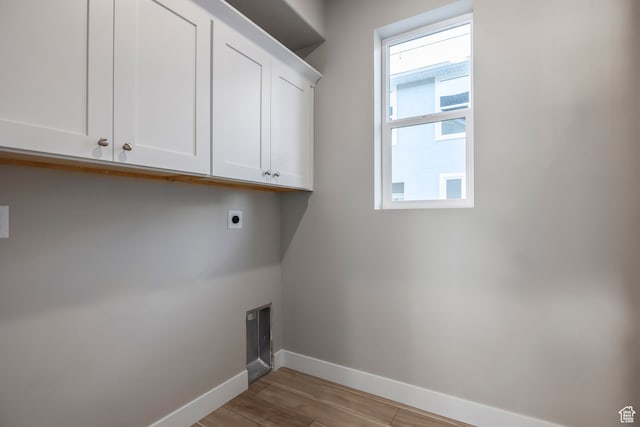 1068 S 2760 E, Spanish Fork, UT 84660 - laundry room with cabinets, electric dryer hookup, and light wood-type flooring