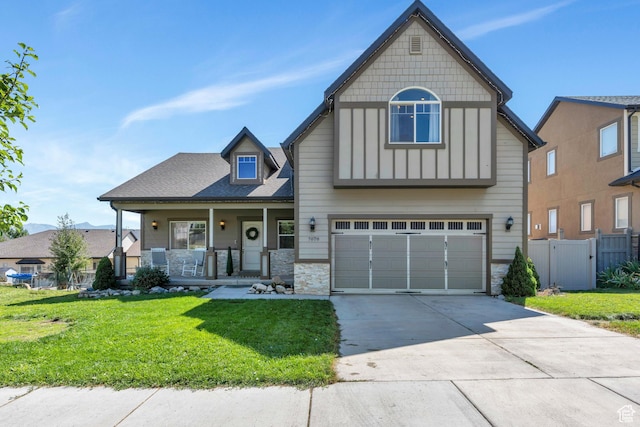 7078 N Sierra Way E, Eagle Mountain, UT 84005 - view of front facade with a garage, covered porch, and a front lawn