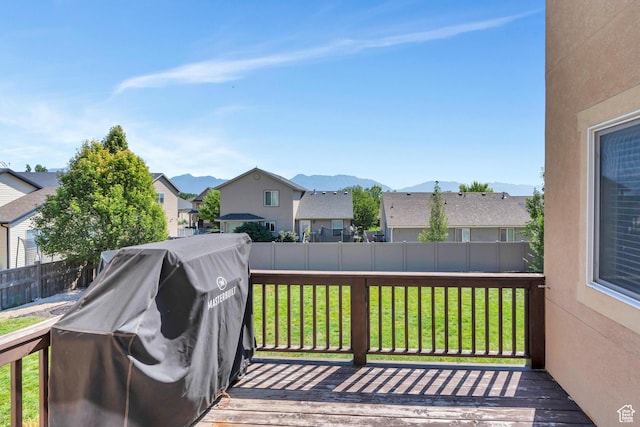 7078 N Sierra Way E, Eagle Mountain, UT 84005 - wooden terrace with a mountain view, a yard, and grilling area