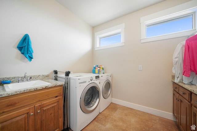 1566 E 300 S, Pleasant Grove, UT 84062 - clothes washing area featuring baseboards, a sink, cabinet space, and washing machine and dryer