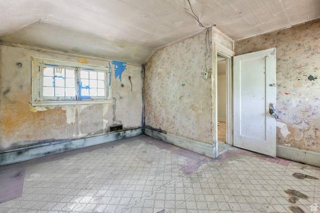 933 W Gentile St, Layton, UT 84041 - empty room featuring tile patterned floors, baseboards, and lofted ceiling