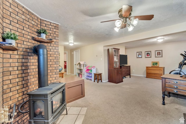 751 W 3500 N, Pleasant View, UT 84414 - carpeted living room featuring ceiling fan, a textured ceiling, and a wood stove