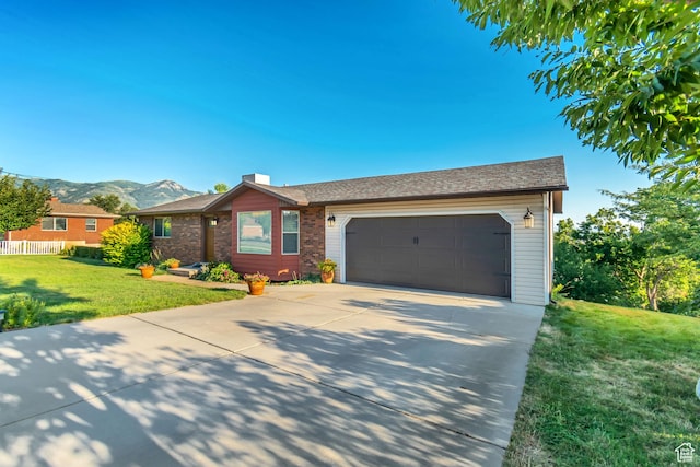 751 W 3500 N, Pleasant View, UT 84414 - single story home featuring a garage, a mountain view, and a front yard