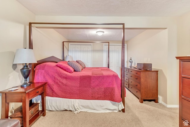751 W 3500 N, Pleasant View, UT 84414 - carpeted bedroom featuring a closet and a textured ceiling