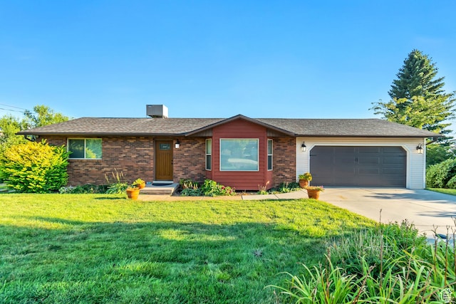 ranch-style home featuring a garage and a front lawn