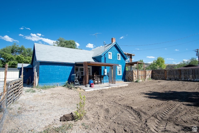 rear view of property with a patio