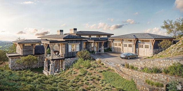1771 N Chimney Rock Rd Unit 521, Heber City, UT 84032 - back of property with stone siding, a balcony, and a detached garage
