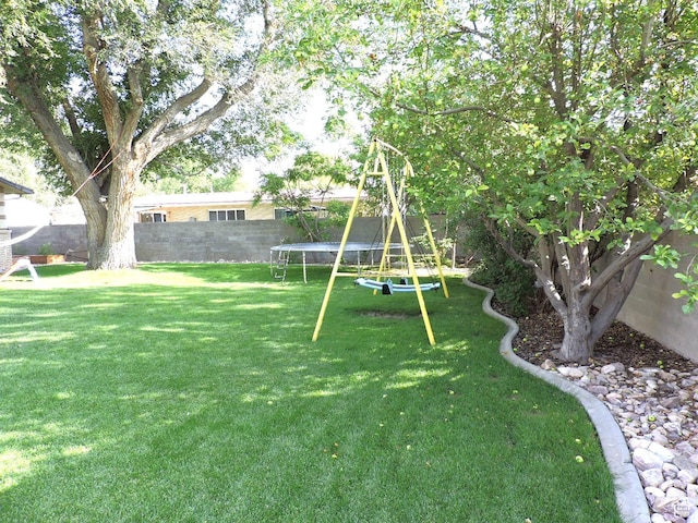 325 N 100 W, Delta, UT 84624 - view of yard with a trampoline and a fenced backyard