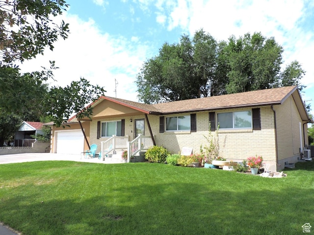 325 N 100 W, Delta, UT 84624 - ranch-style home with brick siding, a front yard, driveway, and a garage