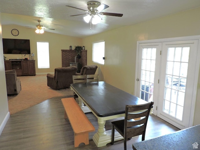325 N 100 W, Delta, UT 84624 - dining space featuring vaulted ceiling, wood finished floors, ceiling fan, and a wood stove