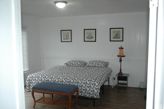 bedroom featuring wood finished floors
