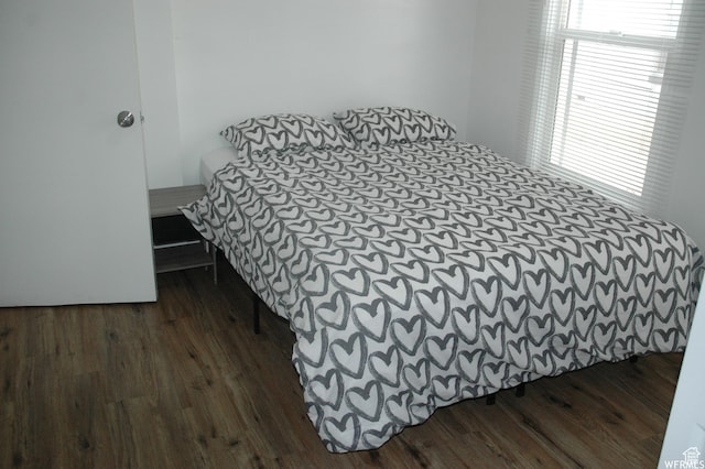 bedroom featuring wood finished floors