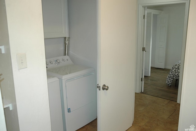 laundry area with washing machine and clothes dryer